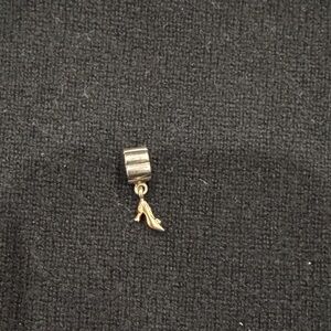 Pandora 14k gold and silver dangle high-heel charm.
